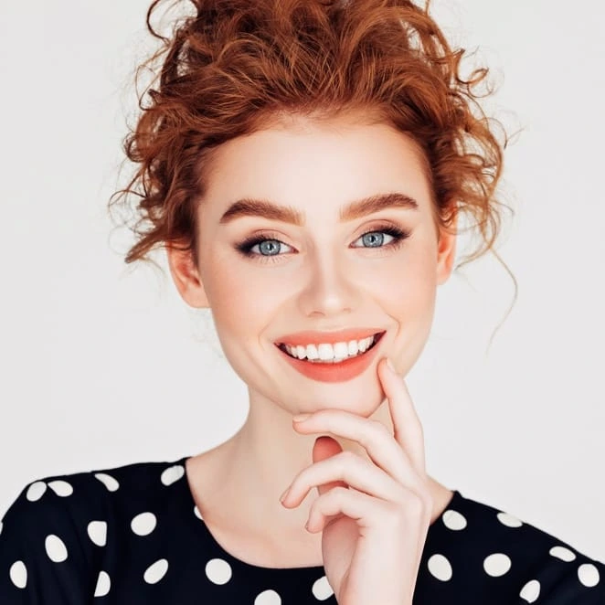 Smiling woman with red hair